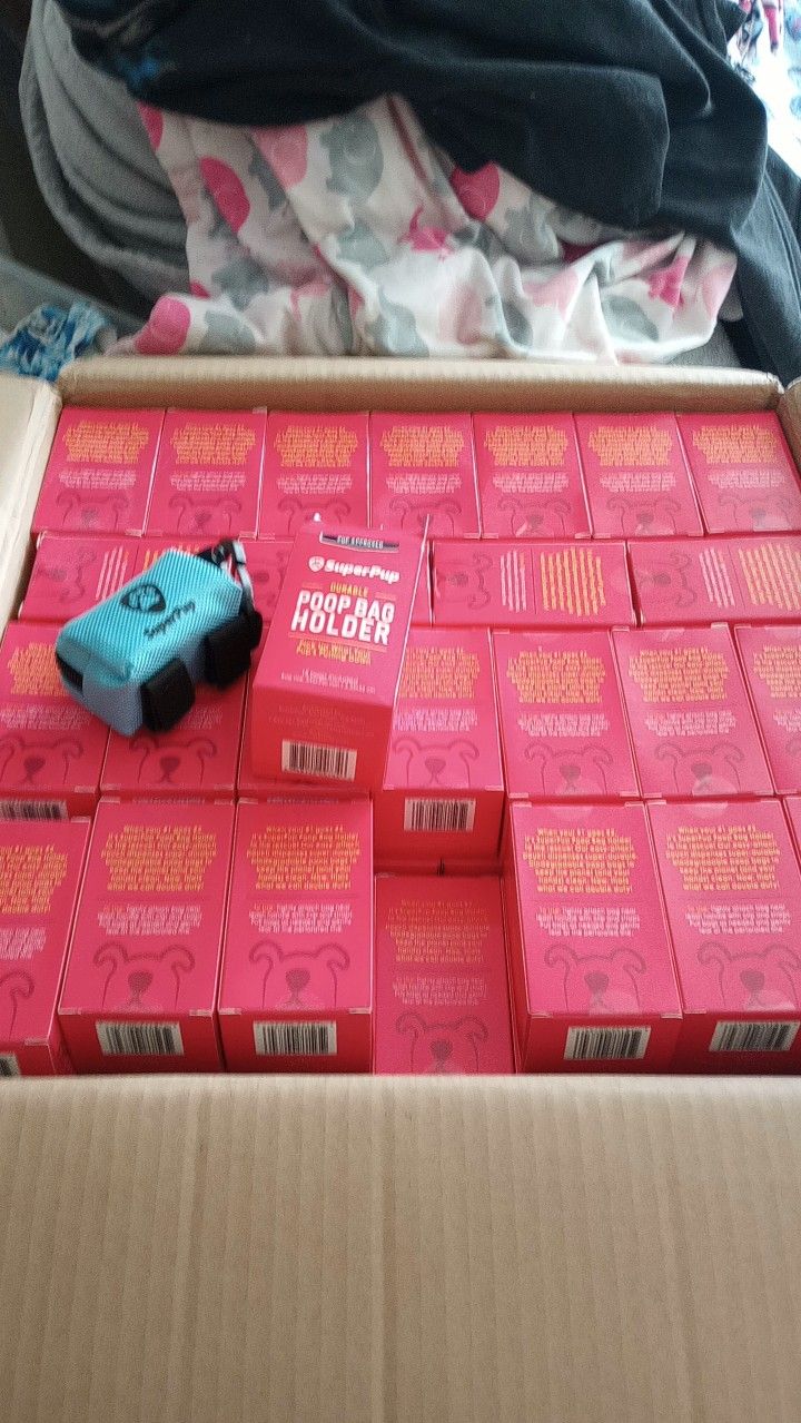 A carton full of boxed dog-walking bag holders.